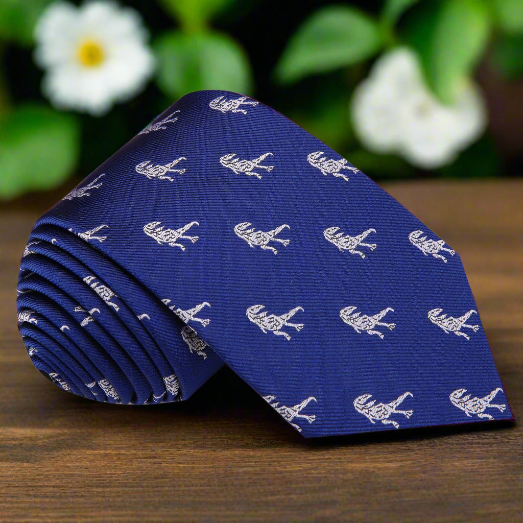 Close-up of Tyrannosaurus Rex pattern on navy silk tie