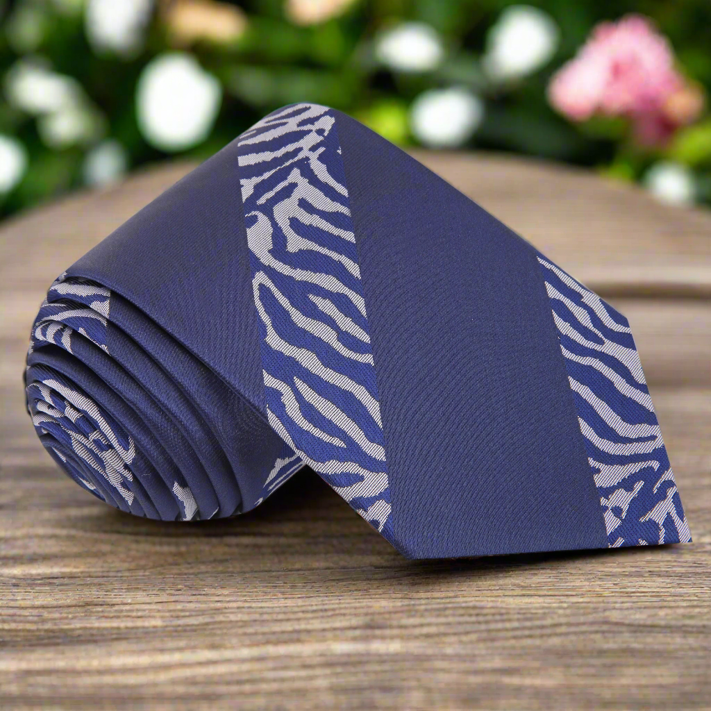 Close-up of silk tiger print necktie featuring dark navy blue and grey tones, ideal for business and formal events