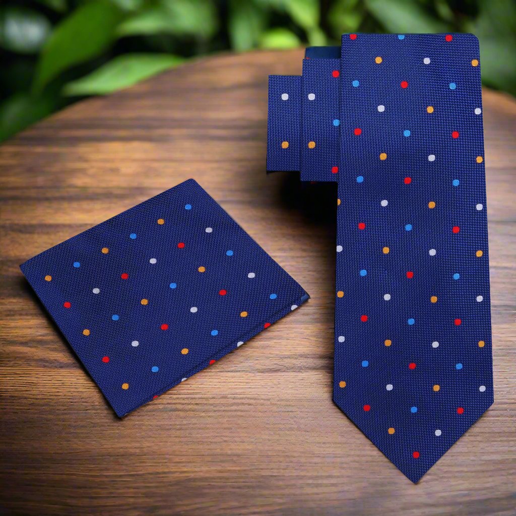 Close-up view of green silk tie with white polka dots folded neatly