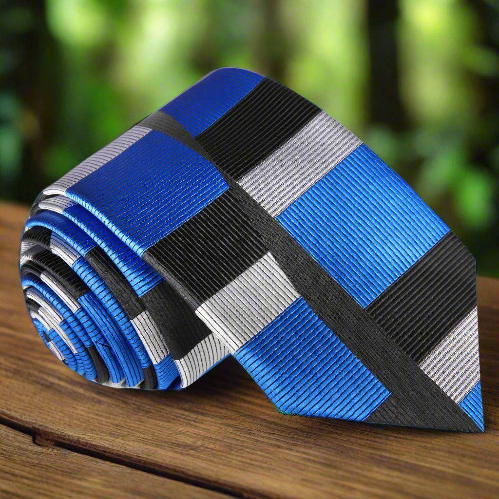 Close-up of Westcott silk necktie with geometric blue and silver pattern