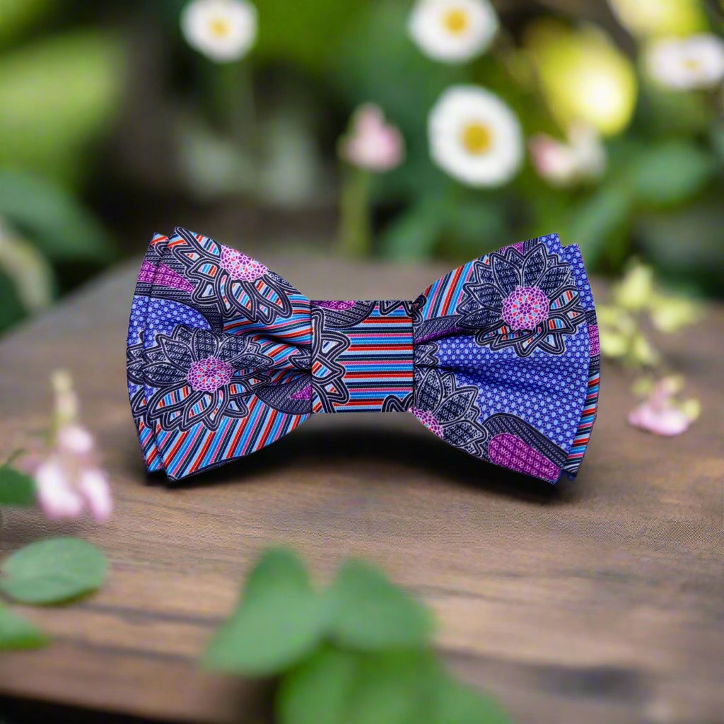 Vibrant silk bow tie with blue and purple flower pattern, ideal for weddings.