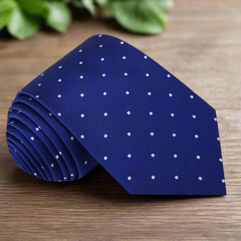 Close-up of blue and white polka dot silk necktie on a mannequin