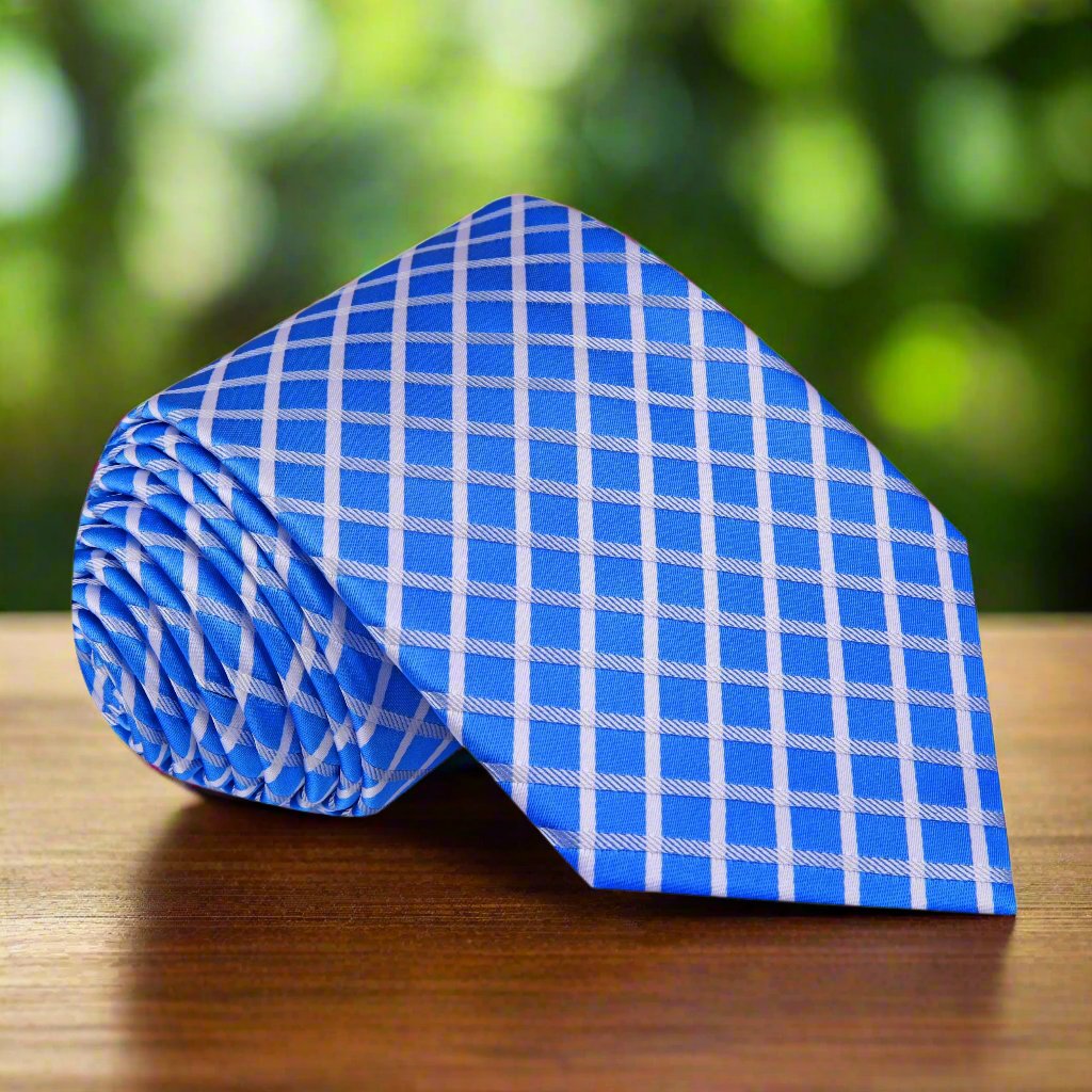 Close-up of the geometric pattern on a blue and white silk necktie, ideal for formal occasions