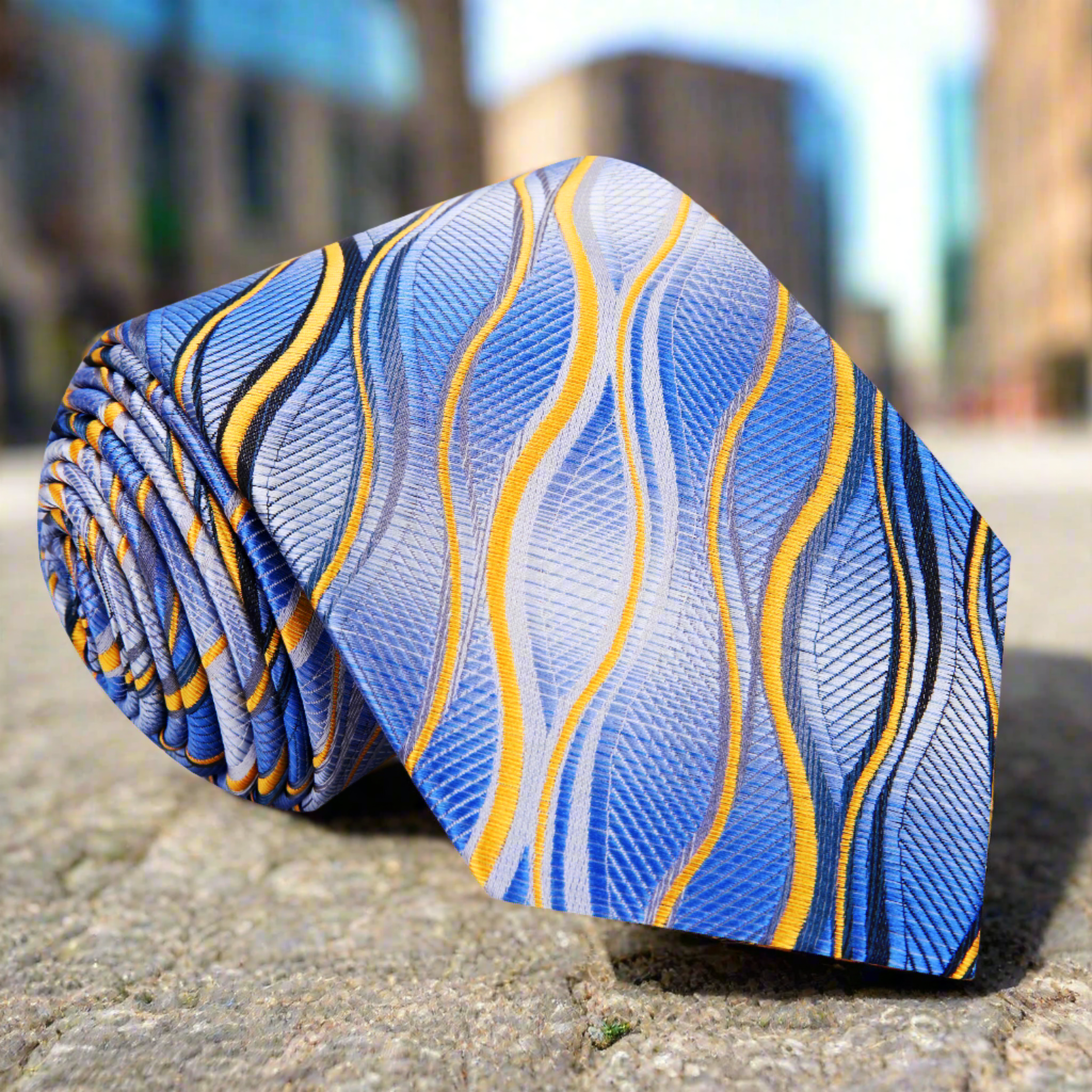 Vibrant silk necktie with lightning stripes in blue and yellow, suitable for weddings and business meetings