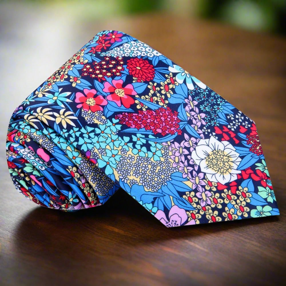 Verde Bloom silk tie styled with a navy suit and white shirt—ideal luxury silk tie for spring events.