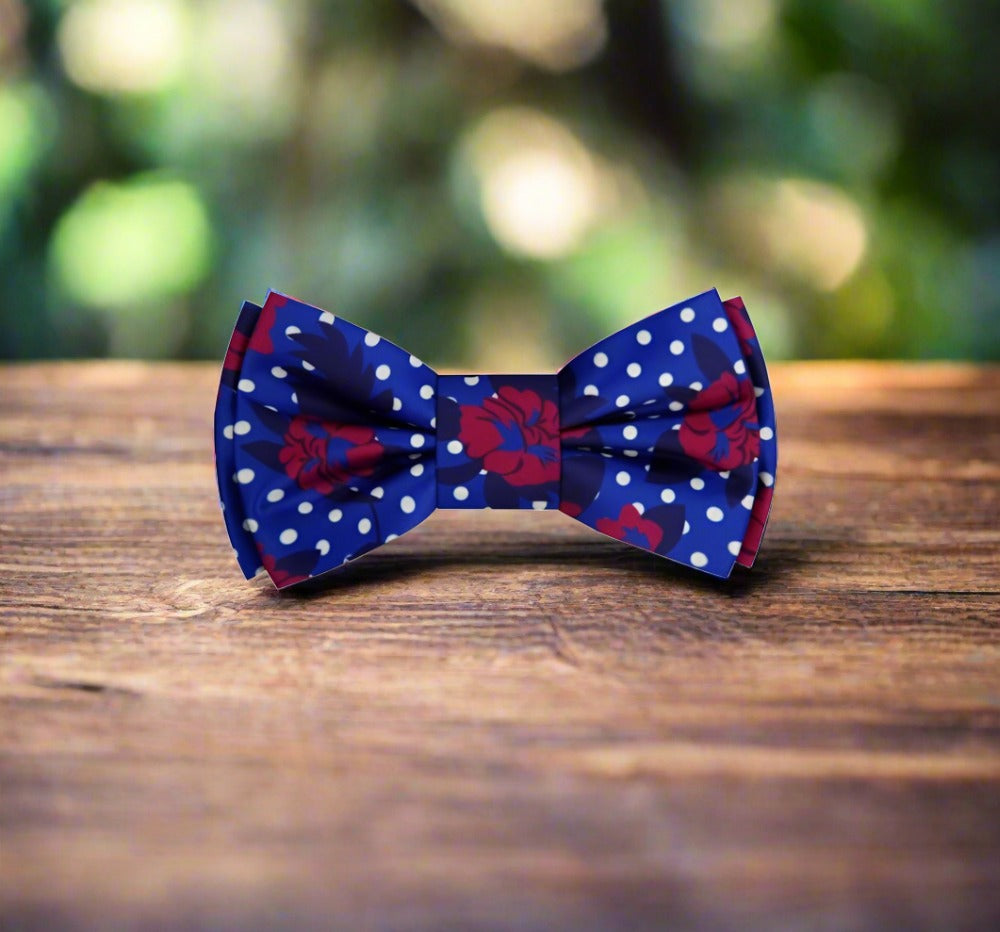 Man adjusting his silk bow tie at a summer wedding, showcasing elegance and style