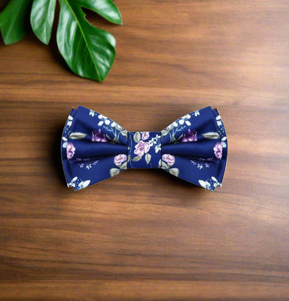 Artistic floral bow tie paired with a white shirt and navy suit for formal events