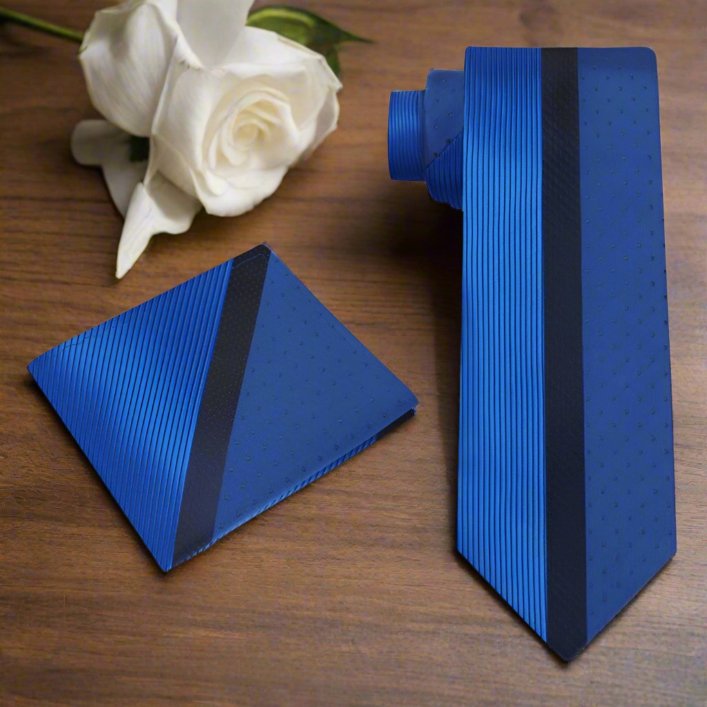 Blue with Dark Blue Center Stripe Silk Necktie laid out against a charcoal grey suit.