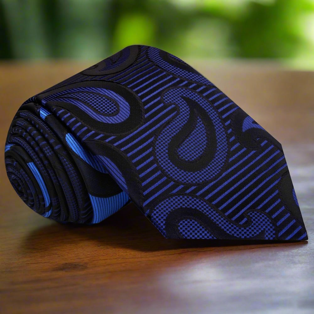 Silk paisley tie styled with a crisp white shirt and navy blazer