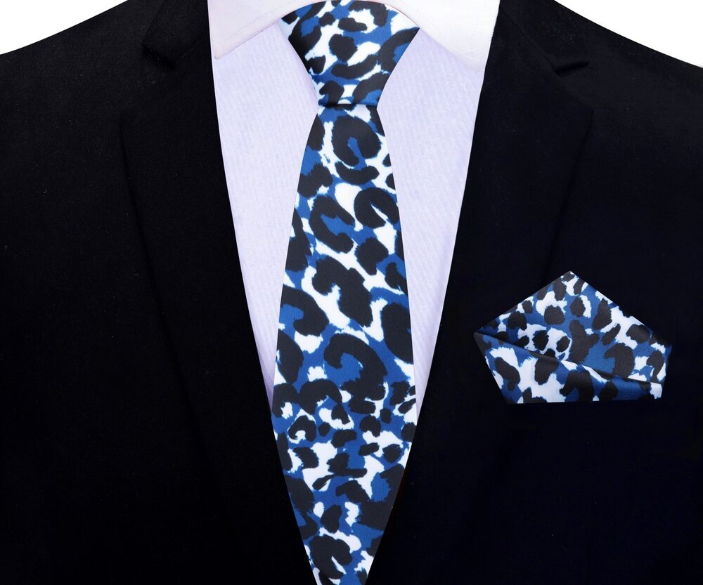 Cheetah print necktie paired with a classic white dress shirt and charcoal grey suit.