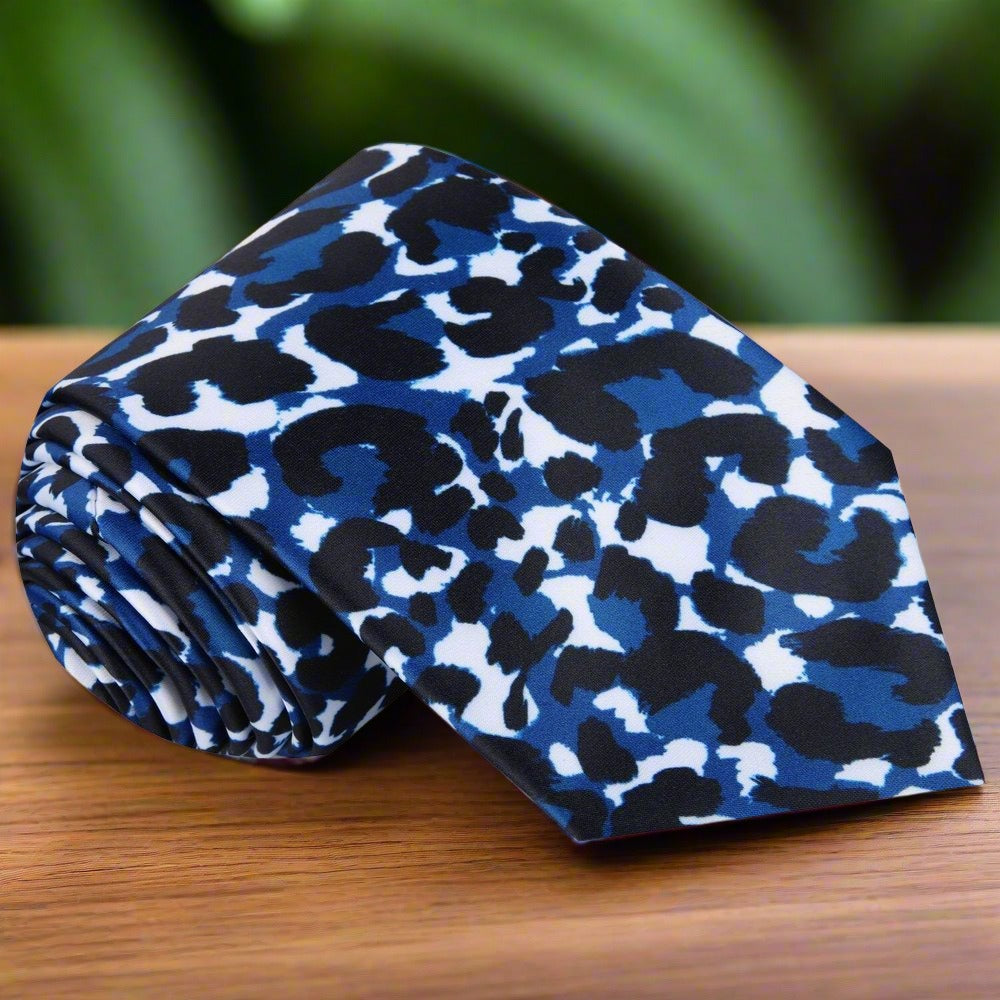 Elegant man wearing a cheetah print tie and matching pocket square for formal event