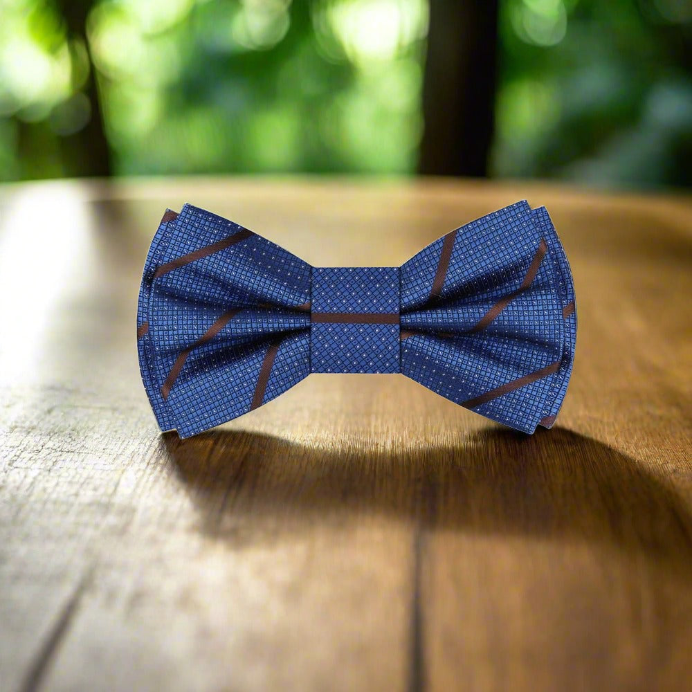 Elegant dark blue silk bow tie with brown stripes on a mannequin for formal wear