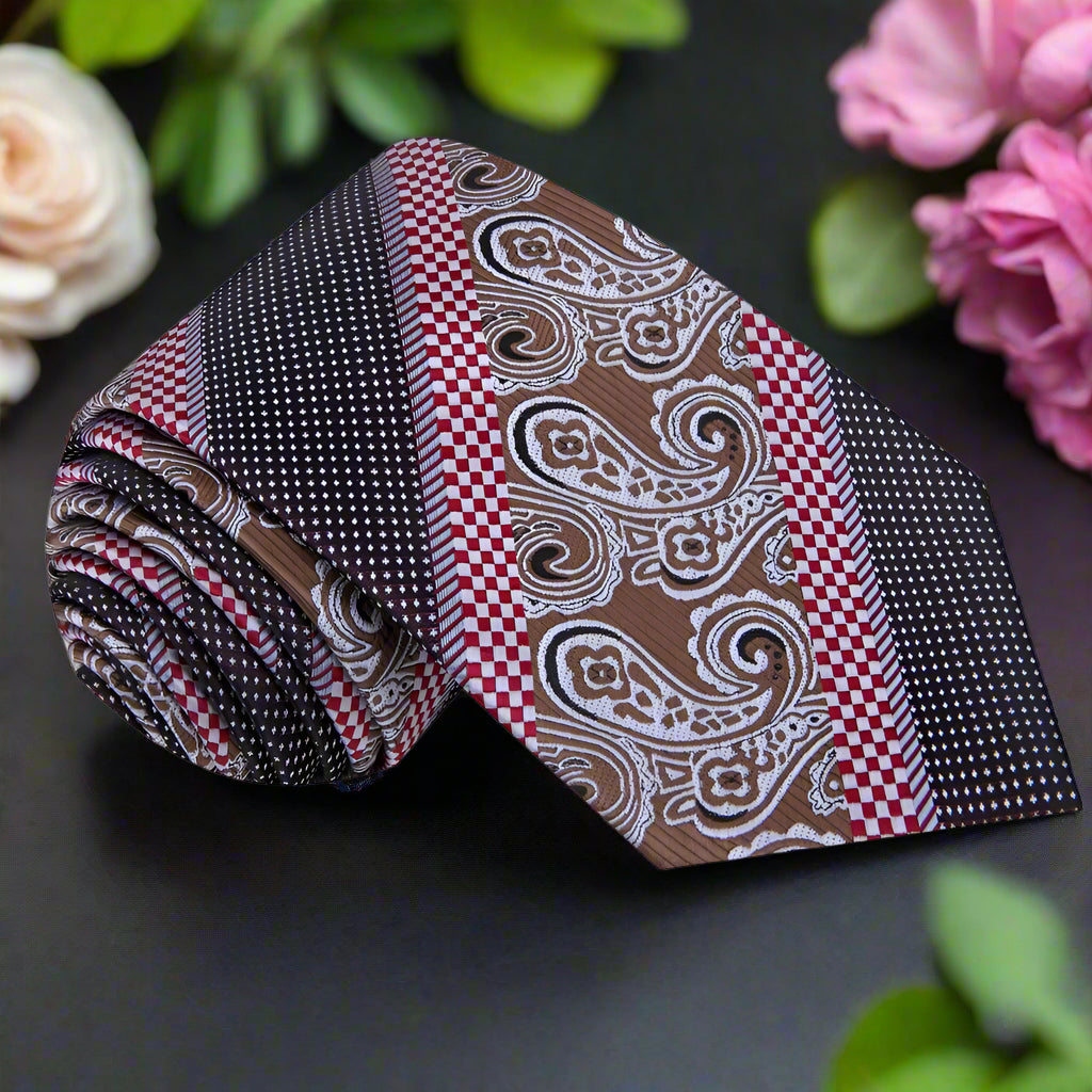 Full view of mens paisley tie with pocket square set styled with navy suit