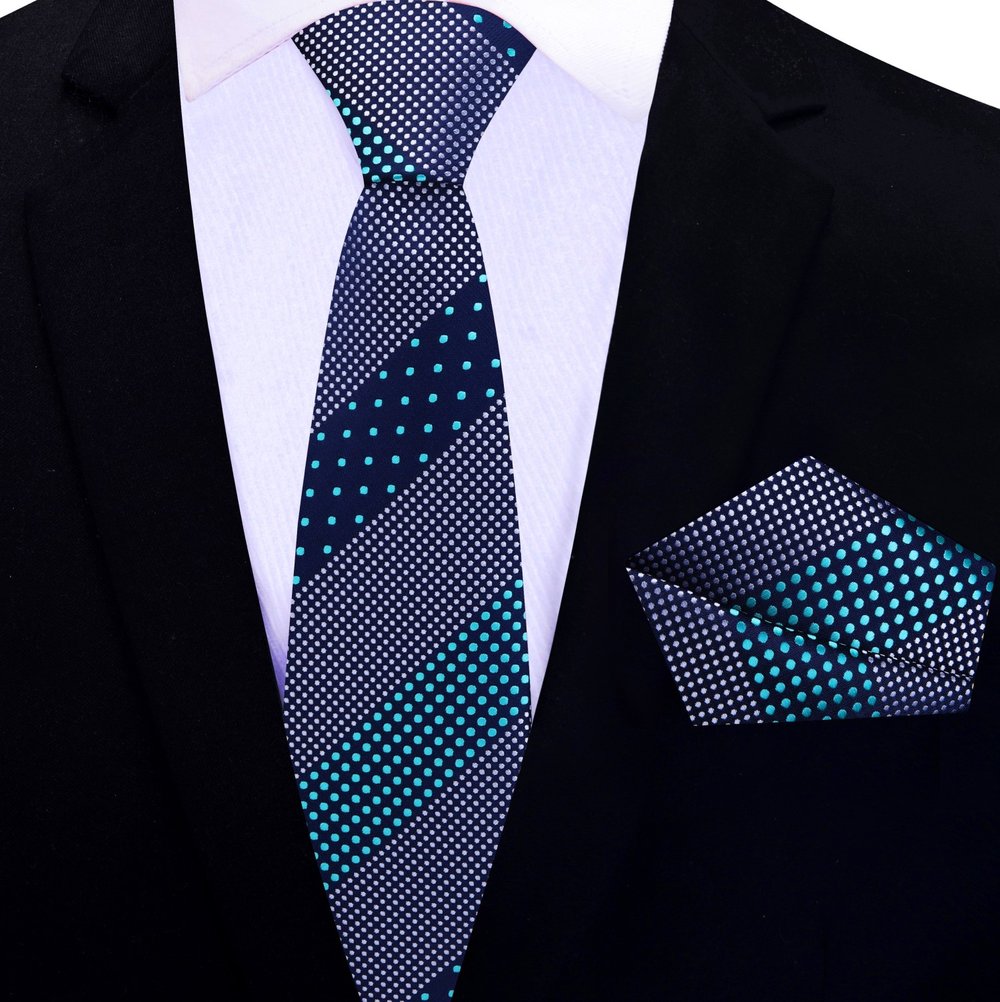 Dark blue silk tie worn with a charcoal suit—perfect business meeting look