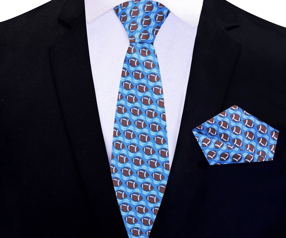 Close-up of blue football tie with brown football pattern for sports fans