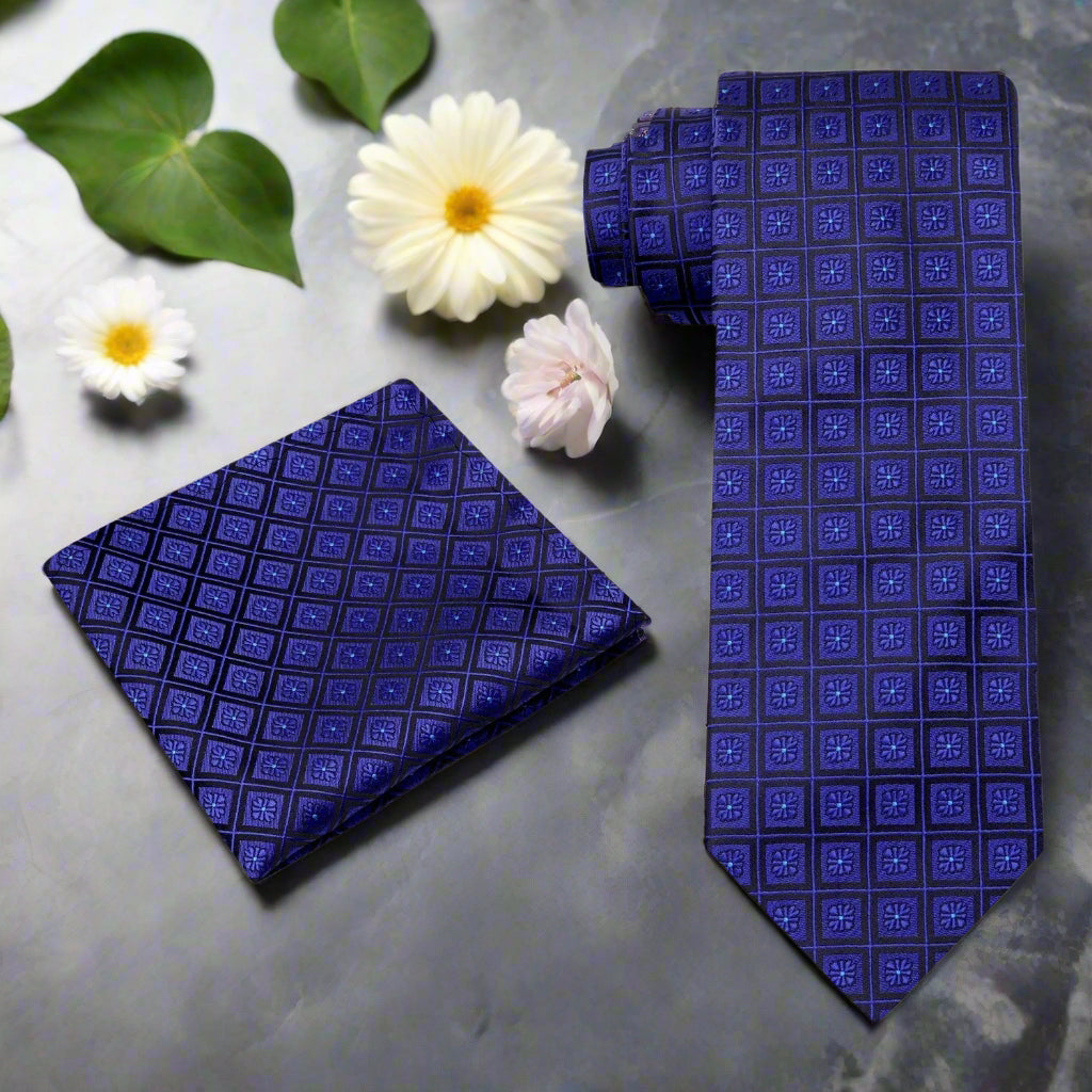 Model showcasing the black geometric necktie paired with a white dress shirt.