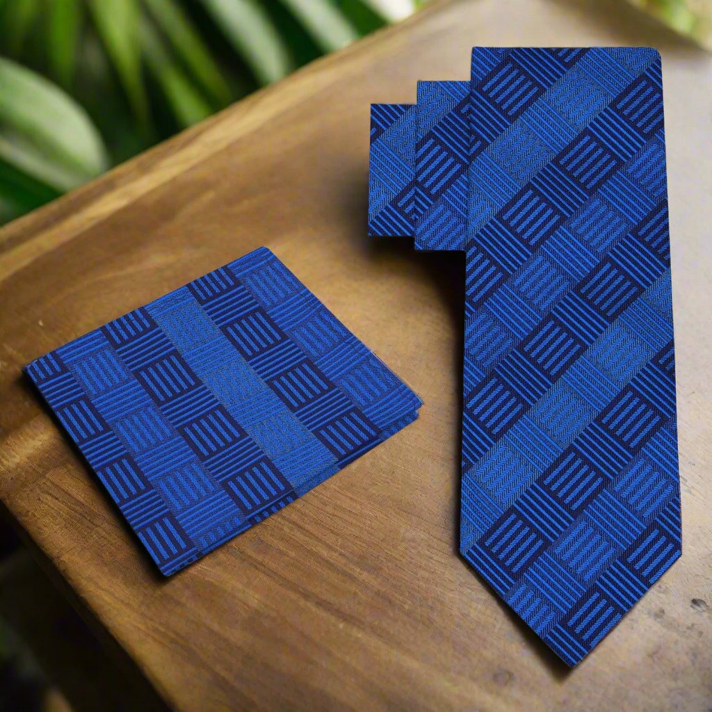 Close-up angle showing the textured pattern of geometric blocks on the silk necktie