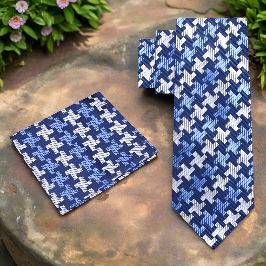 Man wearing a houndstooth silk dress tie with a navy suit for a business conference