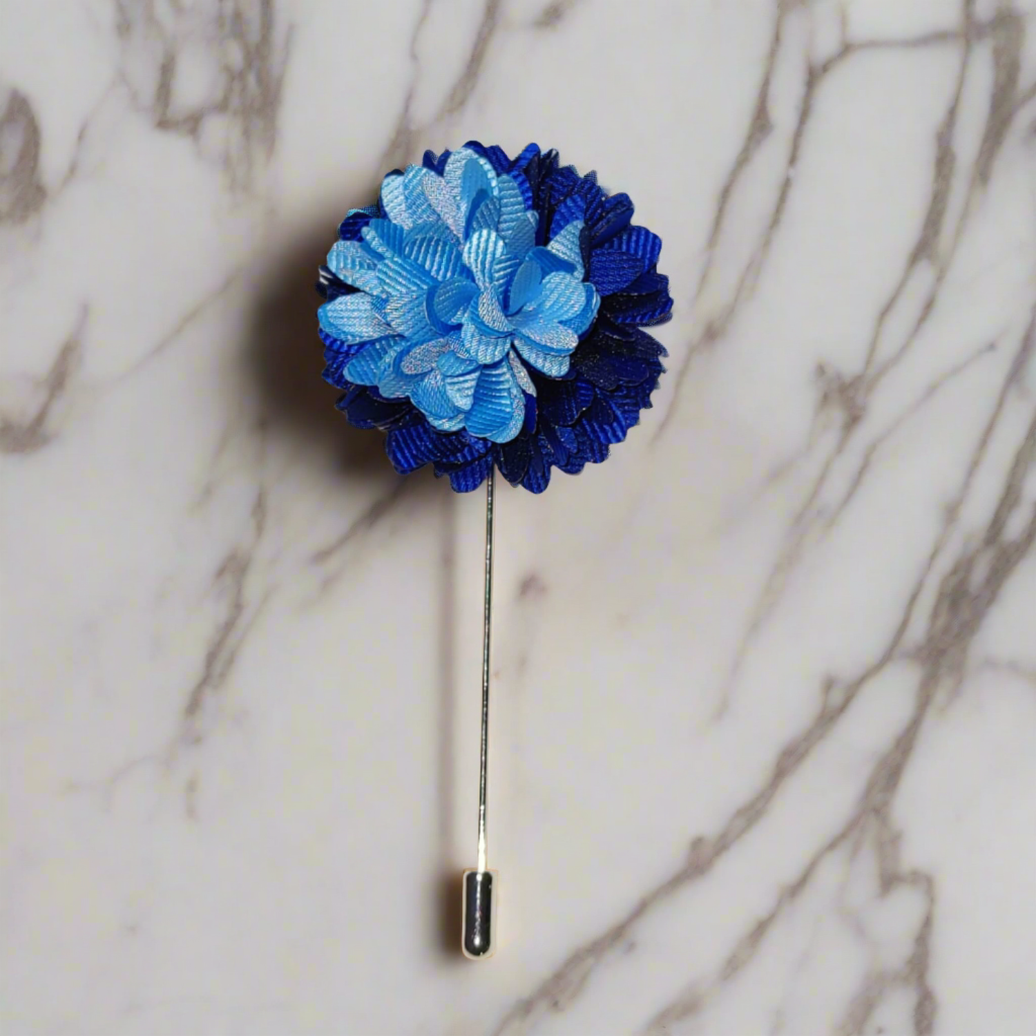 Elegant blue floral lapel pin showcasing intricate details and soft petals.