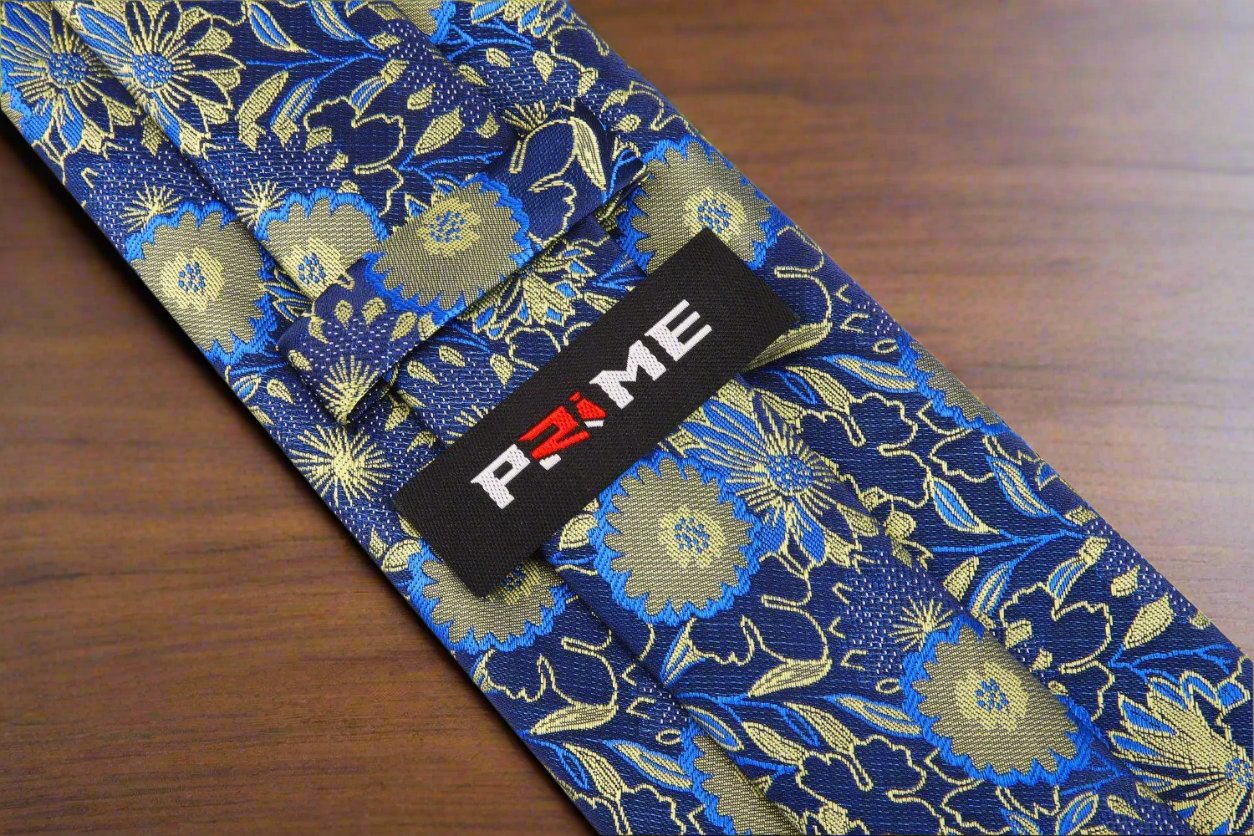 Man wearing elegant floral tie with navy suit for business meeting