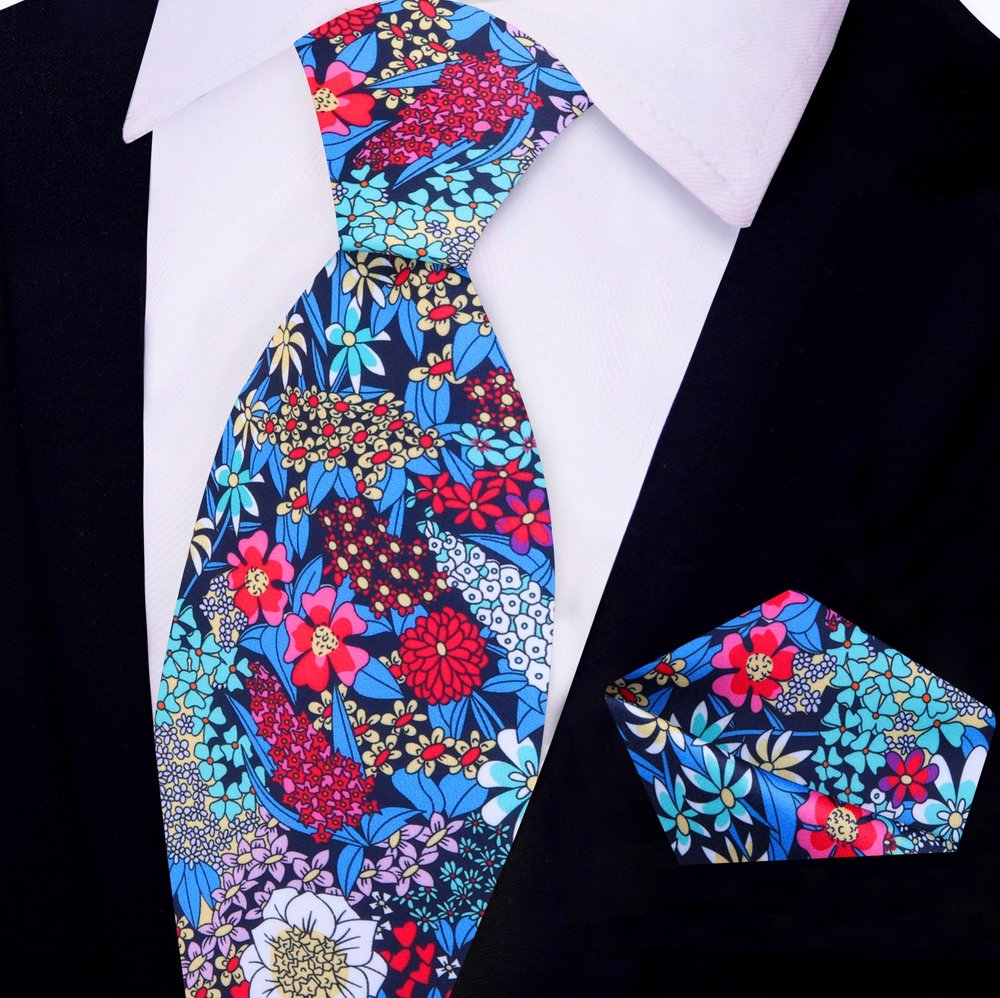 Silk floral necktie styled with navy suit for garden party