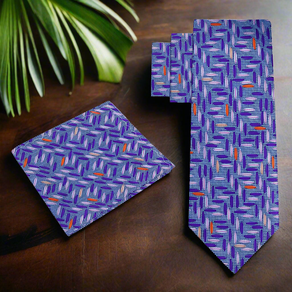 Model wearing the light blue silk necktie paired with a navy suit, highlighting its versatility for formal events.