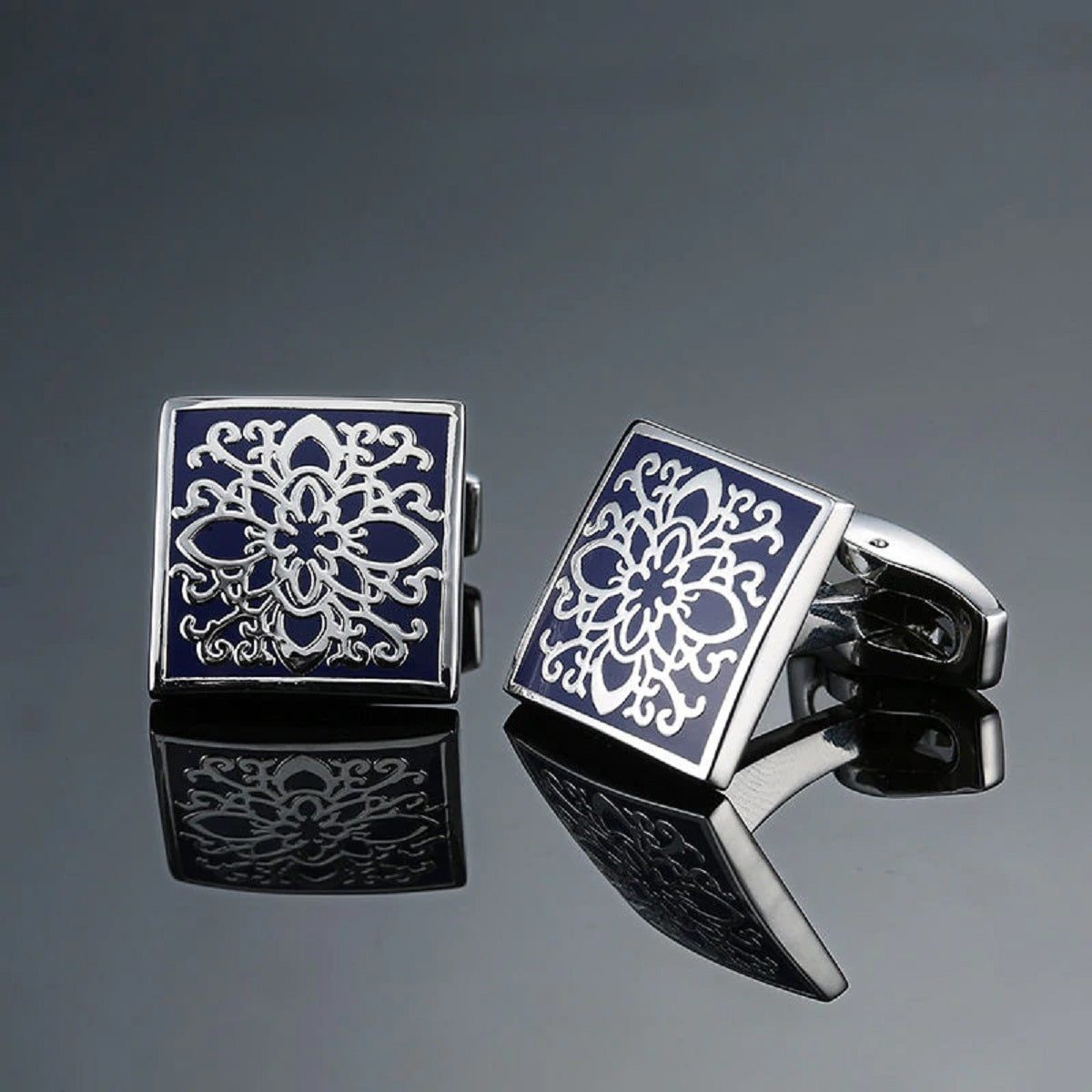 Close-up of intricate silver cufflinks with geometric design for formal occasions