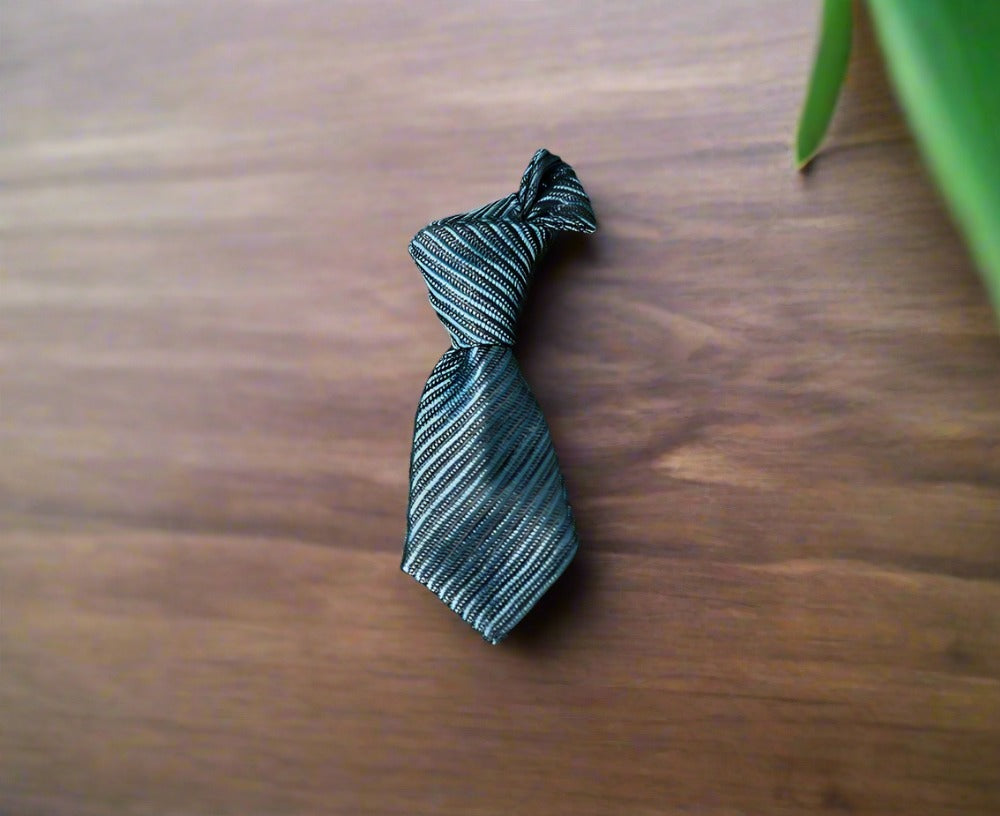 Lapel pin on a light blue dress shirt, highlighting its playful contrast.