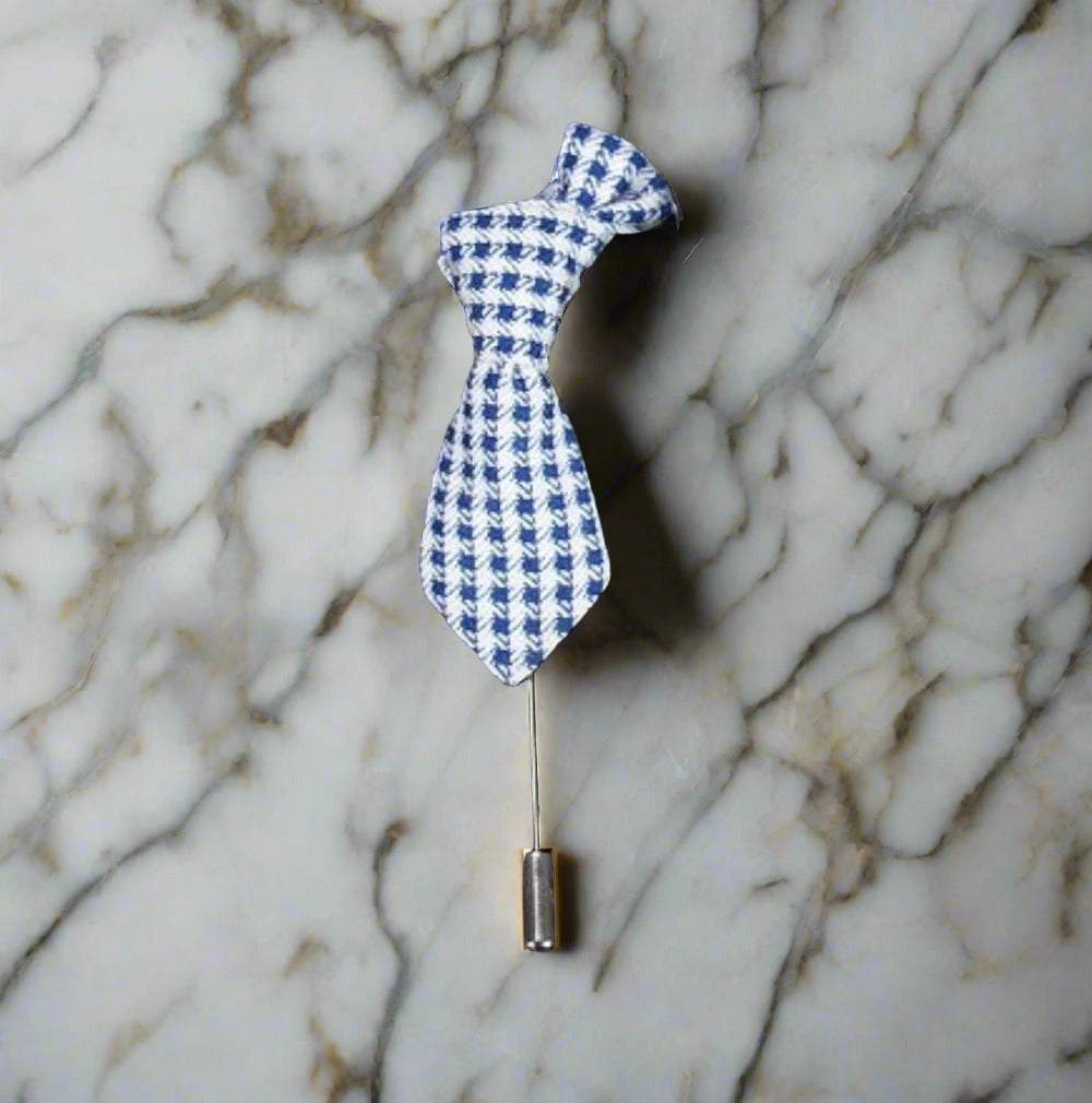 Necktie lapel pin paired with a navy blue suit, adding a sophisticated touch.