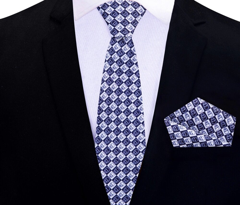 Elegant mens tie with skull design and matching pocket square, ideal for making a statement