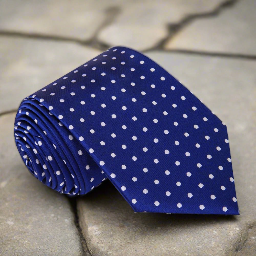 Close-up of green polka dot tie, showcasing its vibrant dots and silk texture.