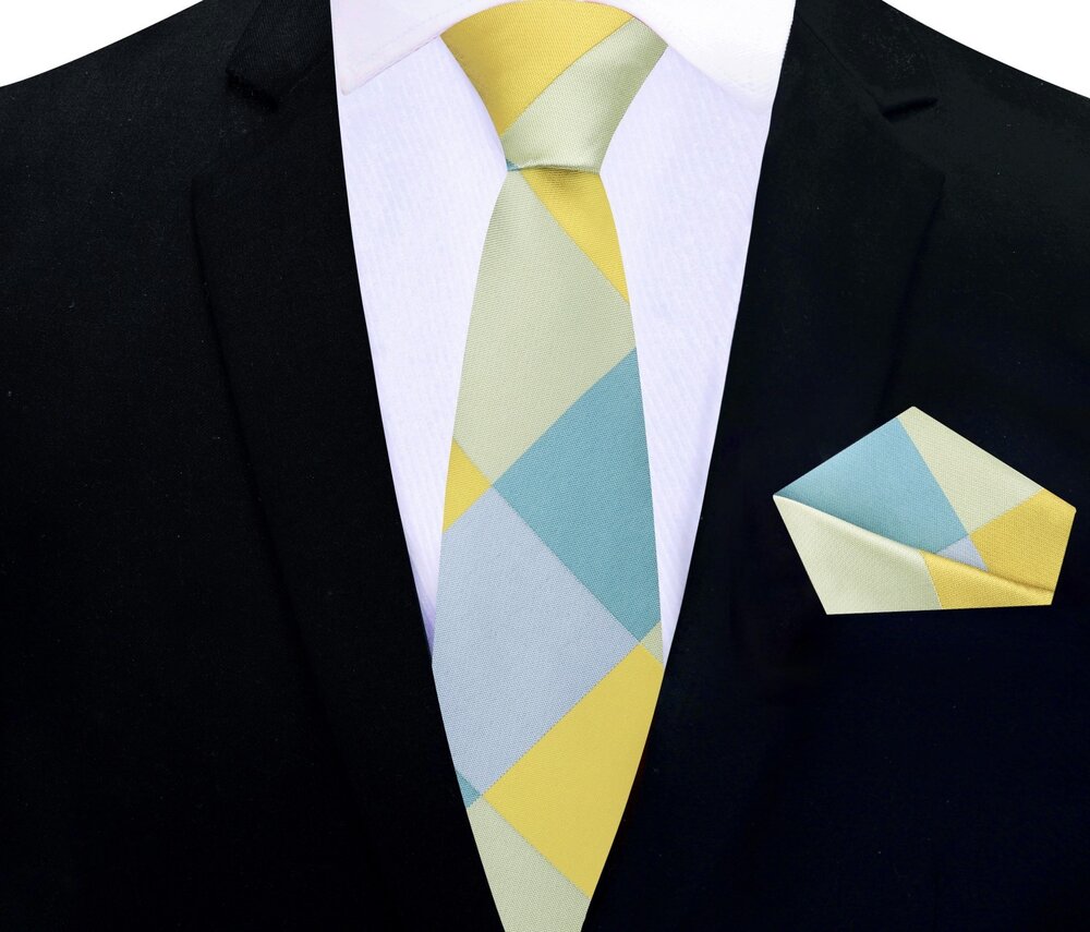Model wearing the Sun-Drop Diamond Silk Tie with a navy blue suit, exuding elegance at a corporate event.