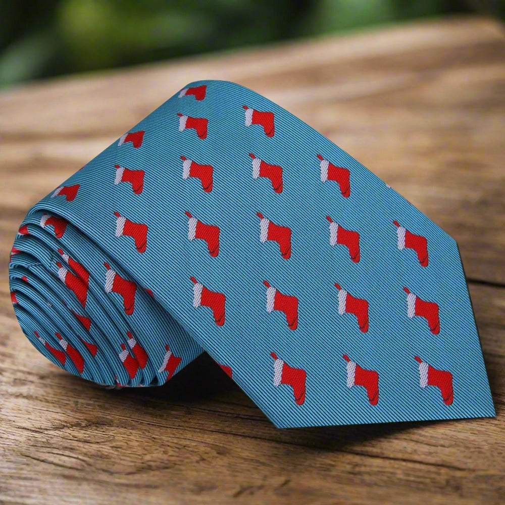 Christmas stockings pocket square displayed with a navy suit.