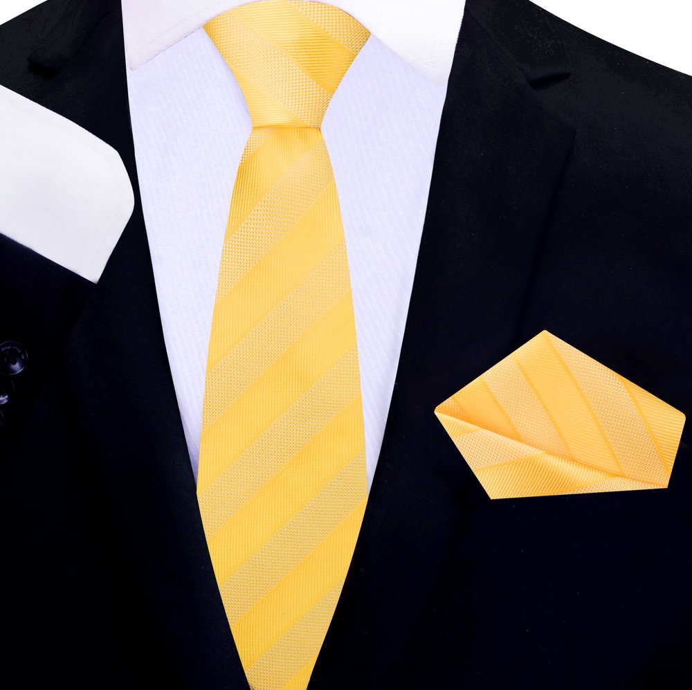 Elegant silk necktie and handkerchief set displayed on a wooden surface for networking events
