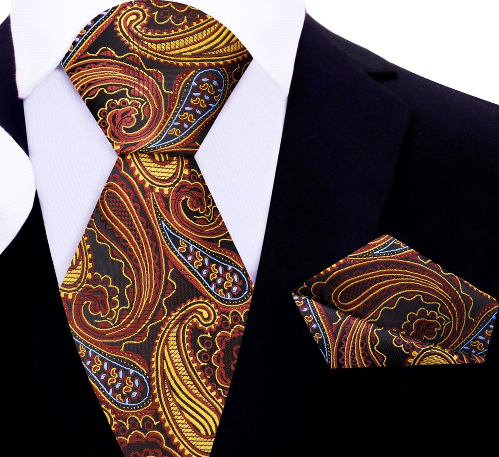 Close-up of the paisley design on the silk tie, highlighting the luxurious texture and rich colors.
