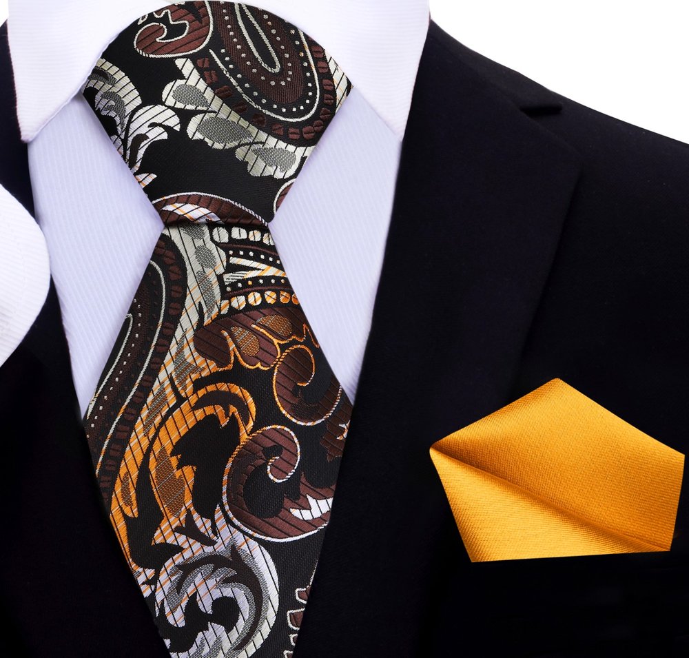 Model wearing the elegant silk tie with a navy suit at a formal event, demonstrating its versatility.