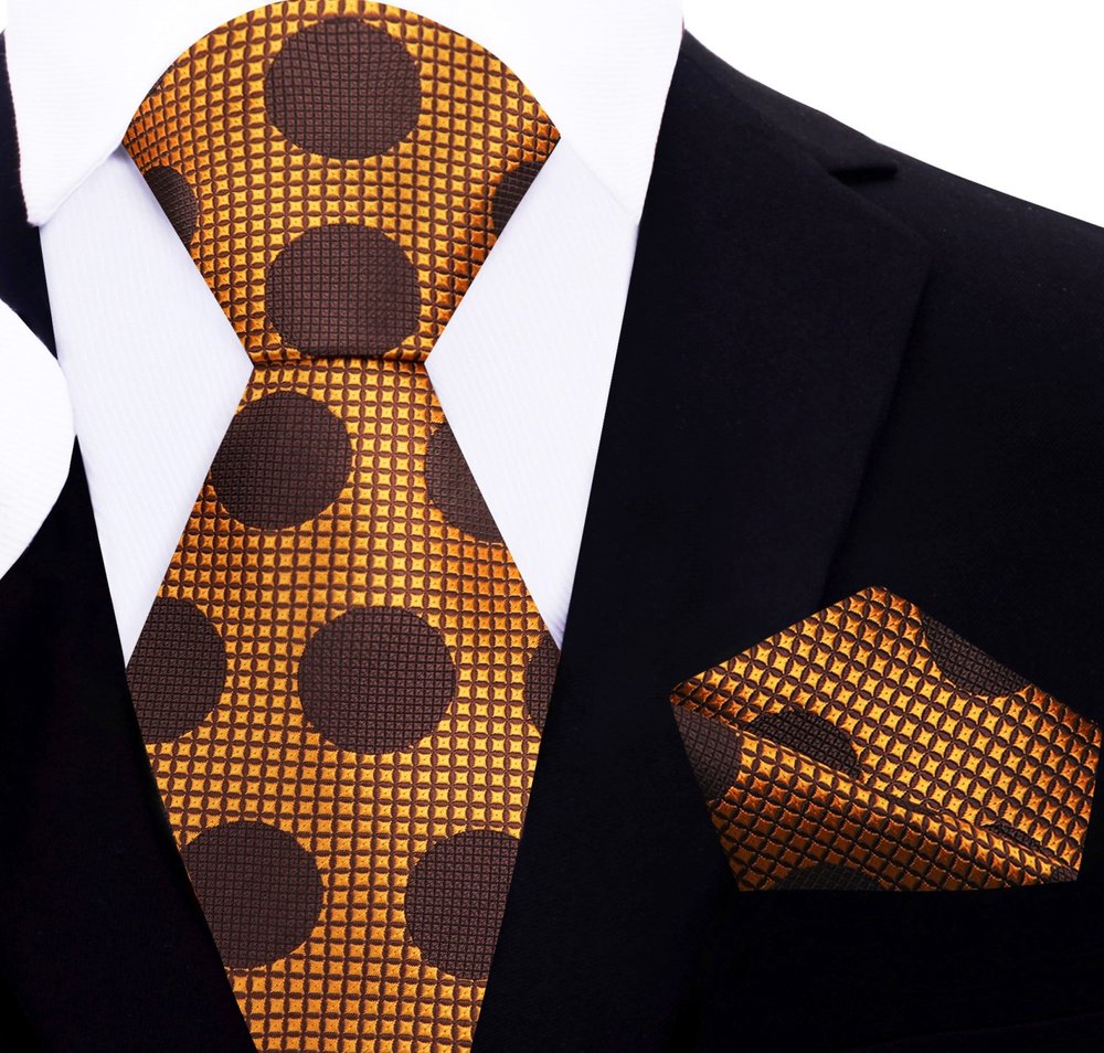 Close-up of the vibrant polka dot silk necktie, emphasizing the texture and quality of the fabric.
