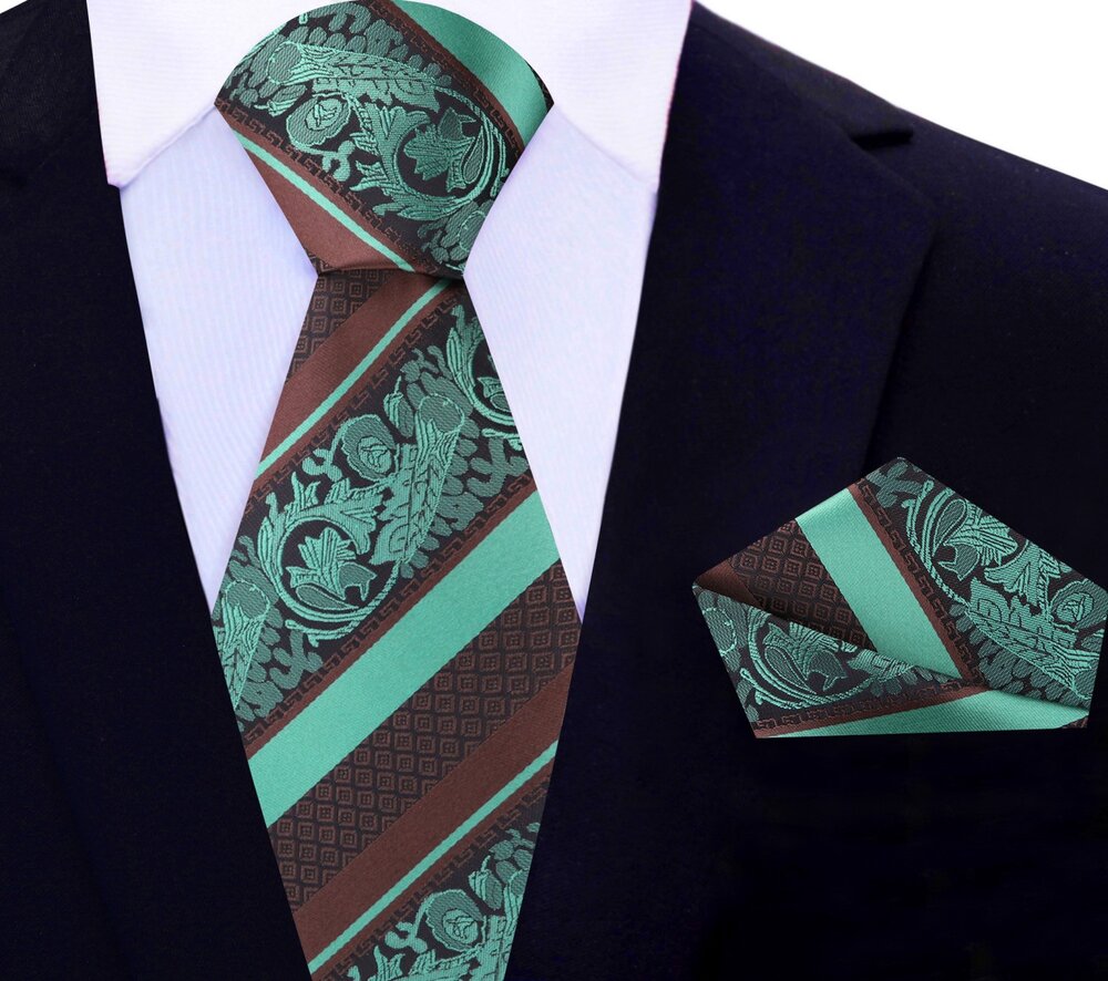 Close-up of the intricate paisley pattern on the brown and mint green silk necktie, showcasing its luxurious texture.