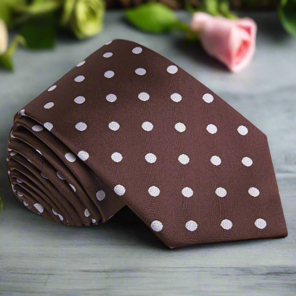 Elegant brown polka dot necktie on a formal dress shirt.