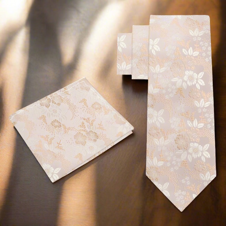 Close-up of the intricate floral pattern on a light pastel necktie for garden parties