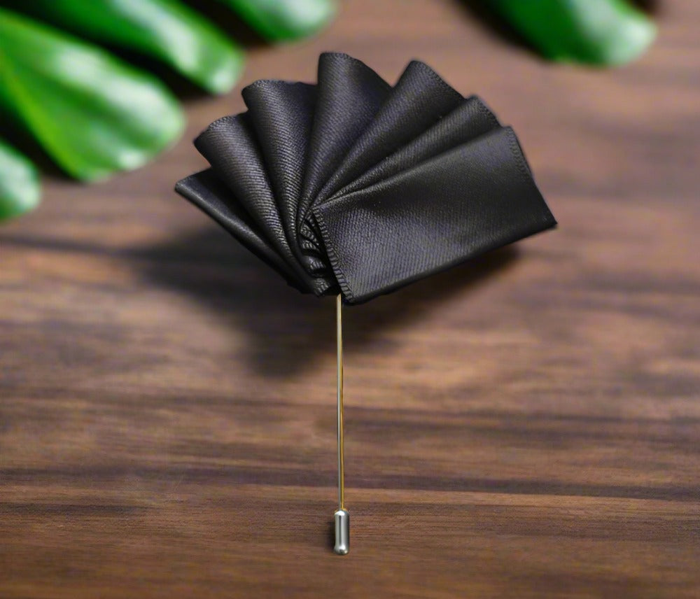 Elegant lapel pin pocket square set in blue with grey edges, showcasing versatility.