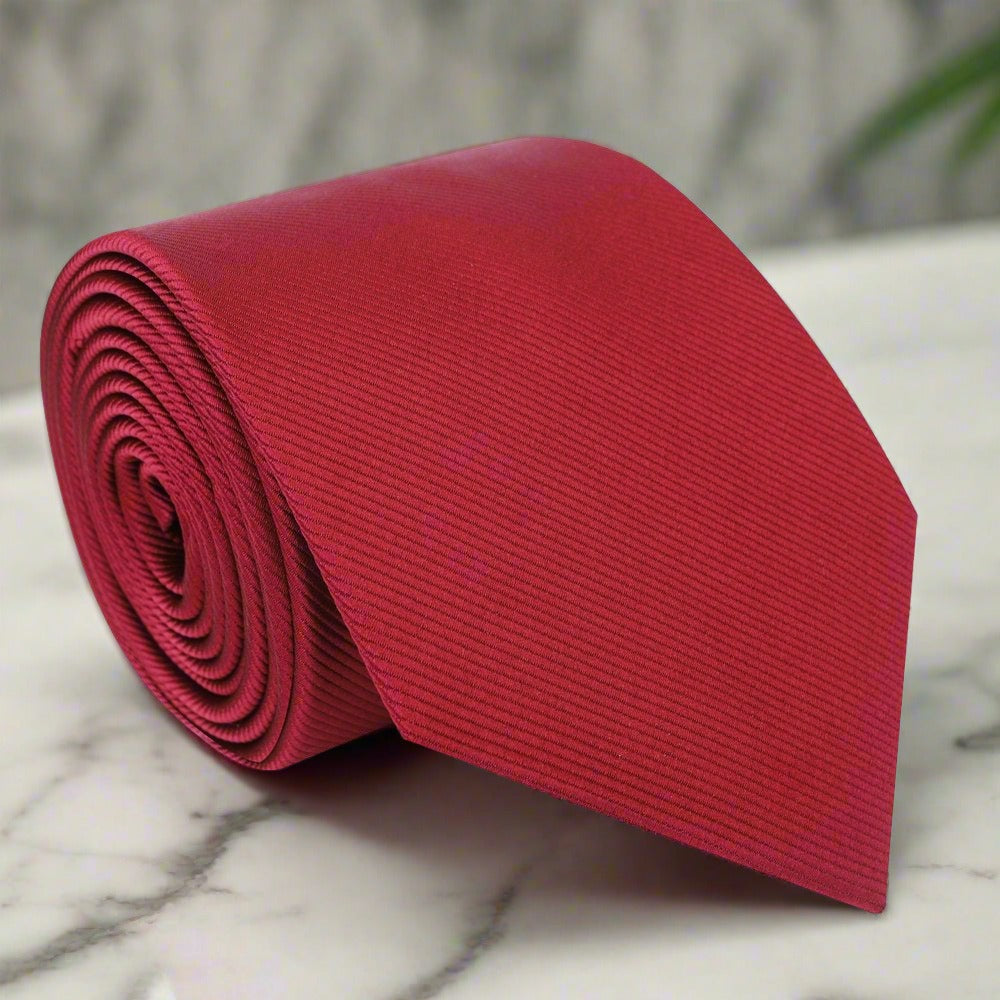 Elegant green necktie with matching pocket square, perfect for business meetings.