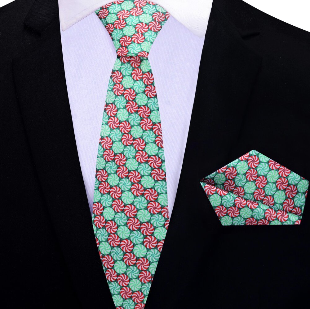 Whimsical Christmas Candy necktie displayed on a white background, showcasing its vibrant red and green colors.