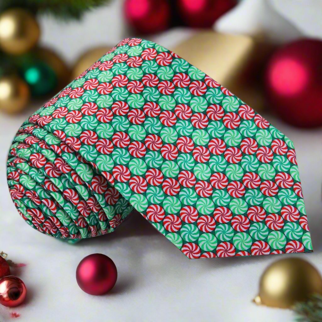 Whimsical Christmas Candy necktie displayed on a white background, showcasing its vibrant red and green colors.