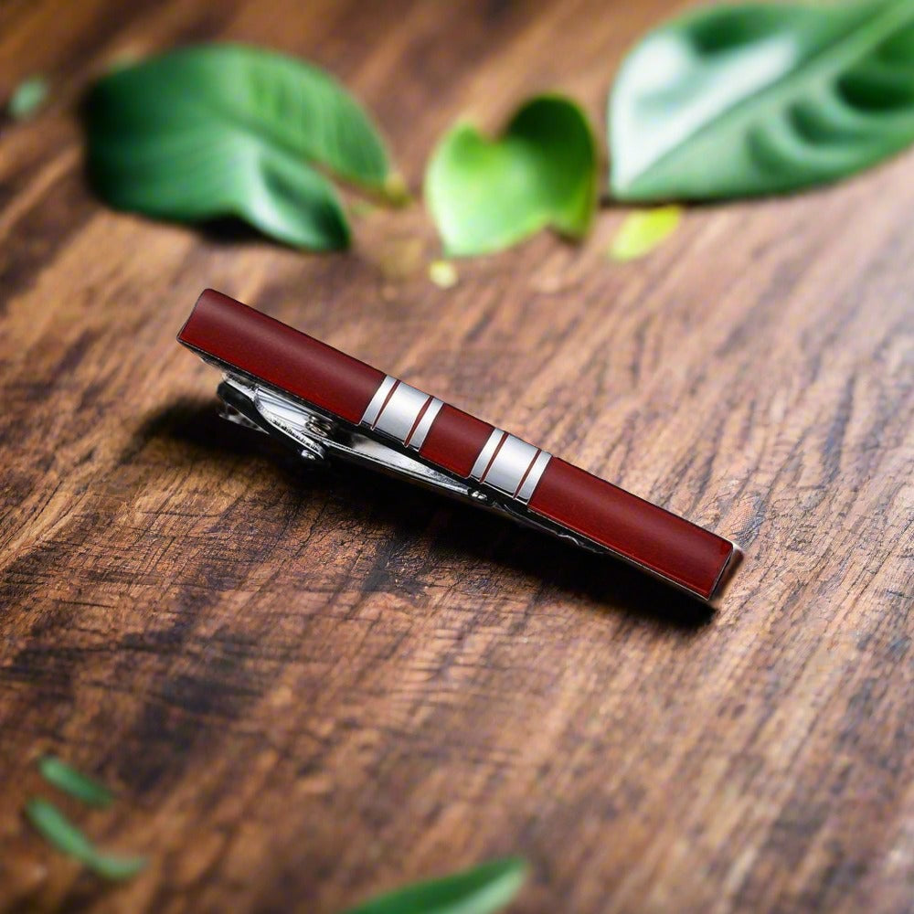 Gold checkerboard tie bar, adding a touch of modern elegance to mens dress accessories.
