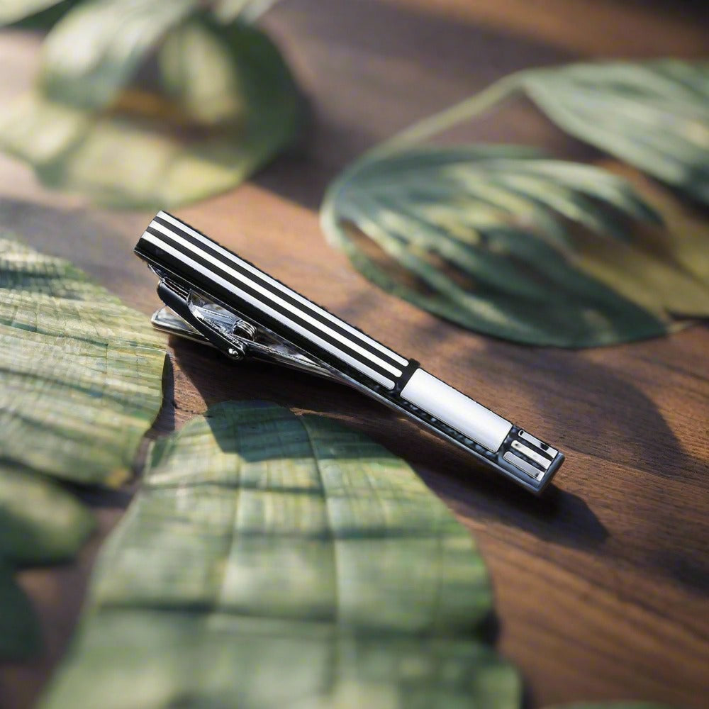 Zebra pattern tie bar with stone accents, ideal for a unique and stylish look.