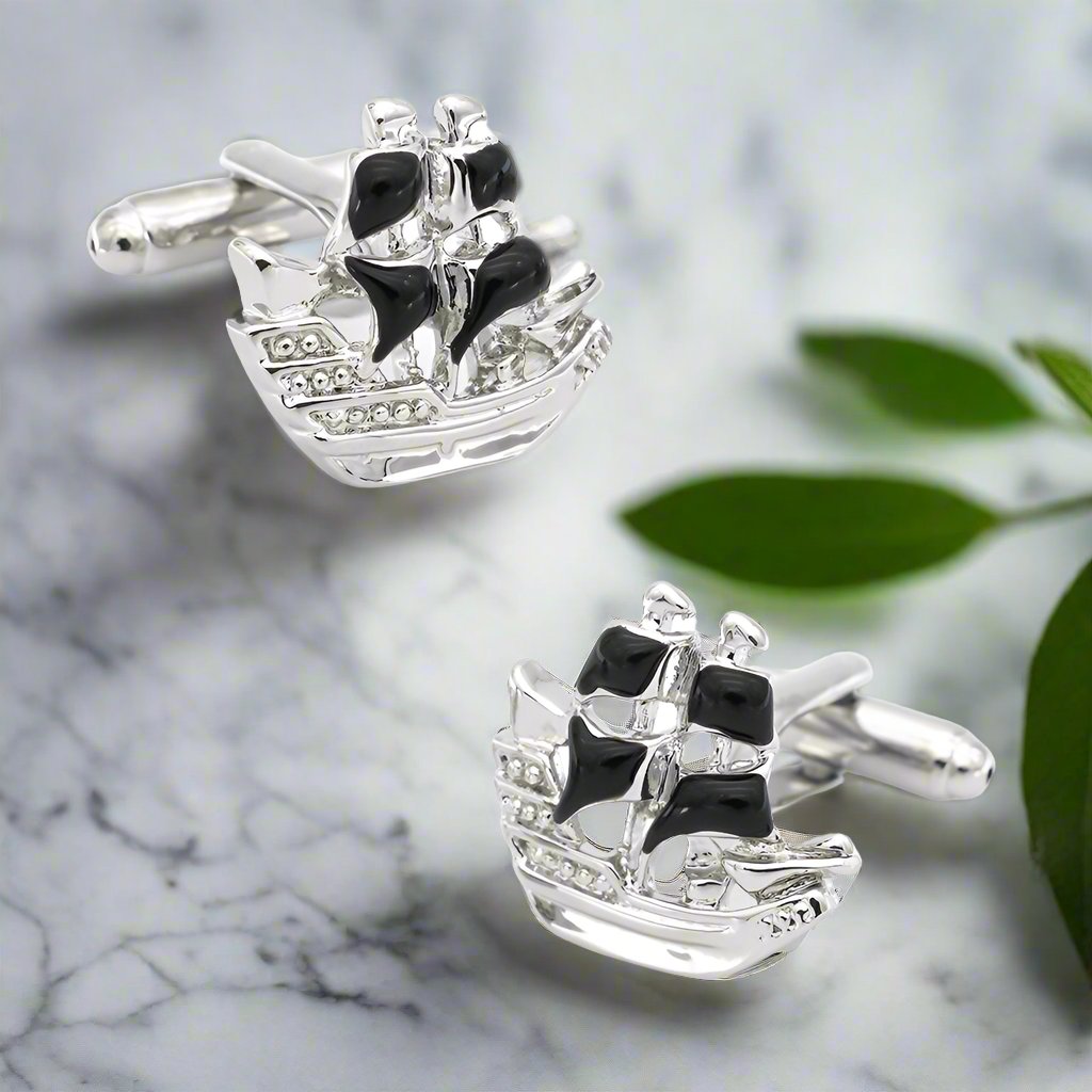 Close-up of pirate ship cufflinks on a white dress shirt, perfect for casual Fridays