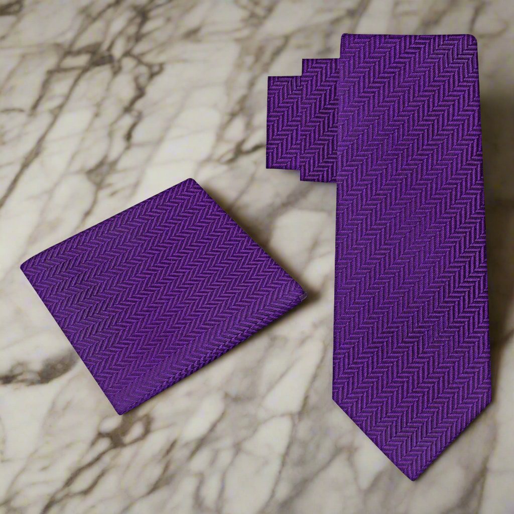 Purple silk necktie paired with a dark charcoal suit, highlighting the contrast and formal appearance.