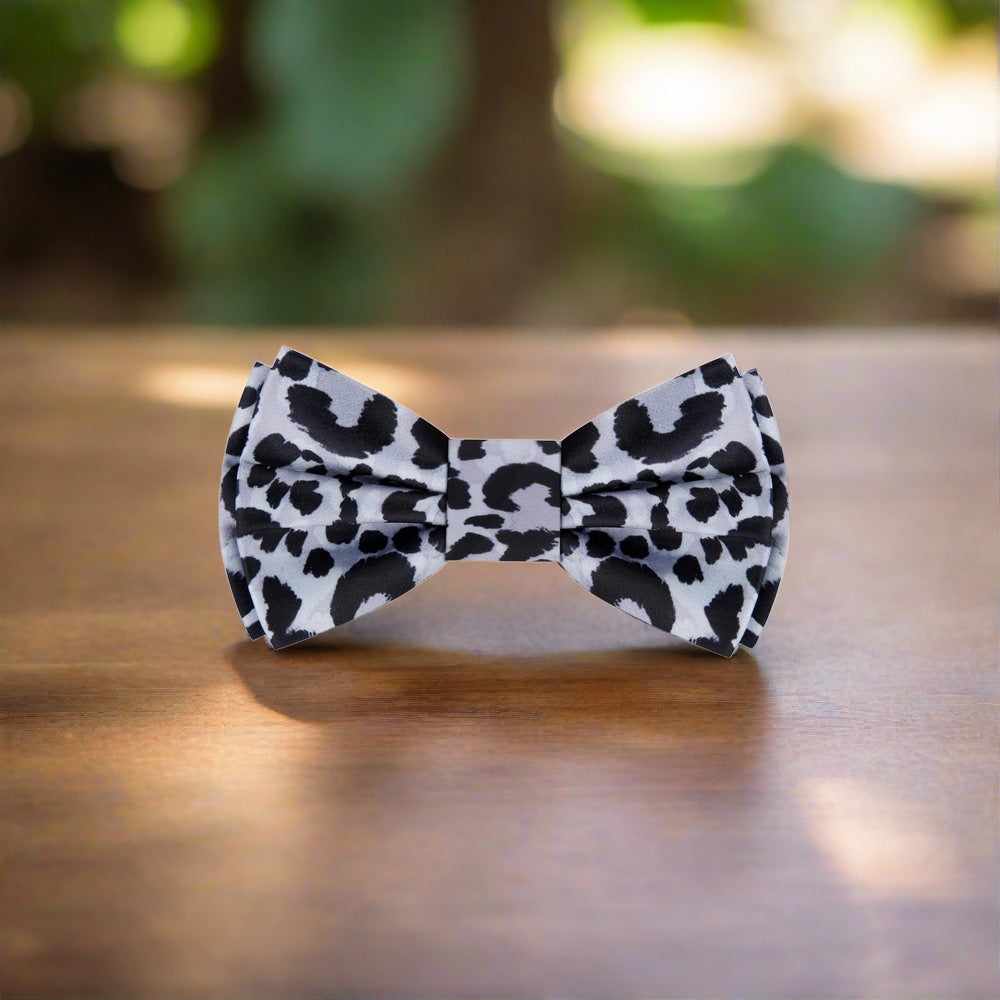 Elegant cheetah pattern silk bow tie styled with a dress shirt for formal events