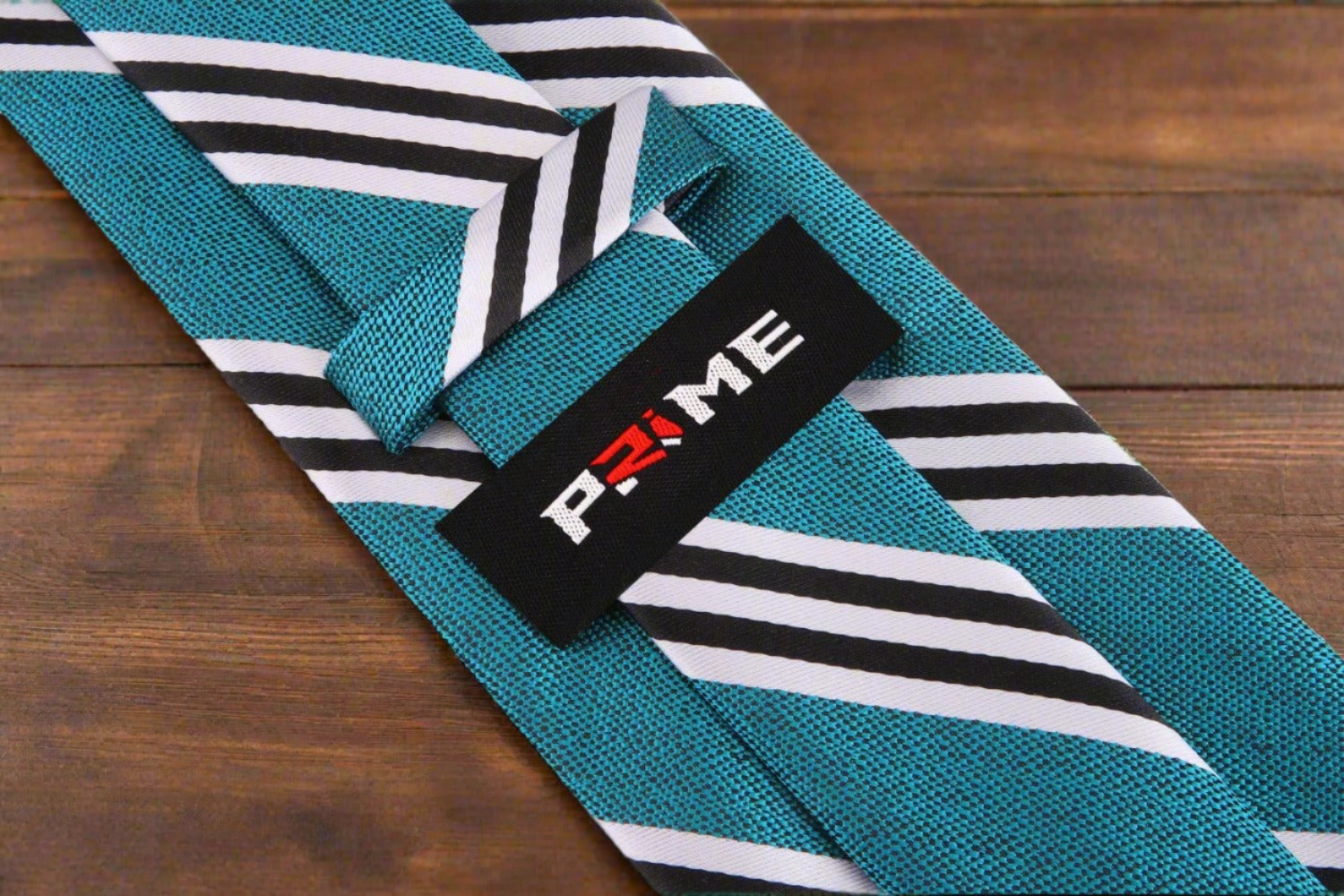 Detailed view of the green striped tie against a navy suit